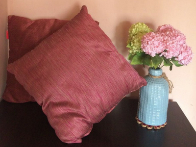 Get Cushiony with colourful pom poms